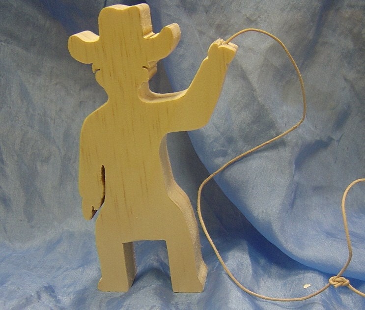 Wooden cowboy with lasso