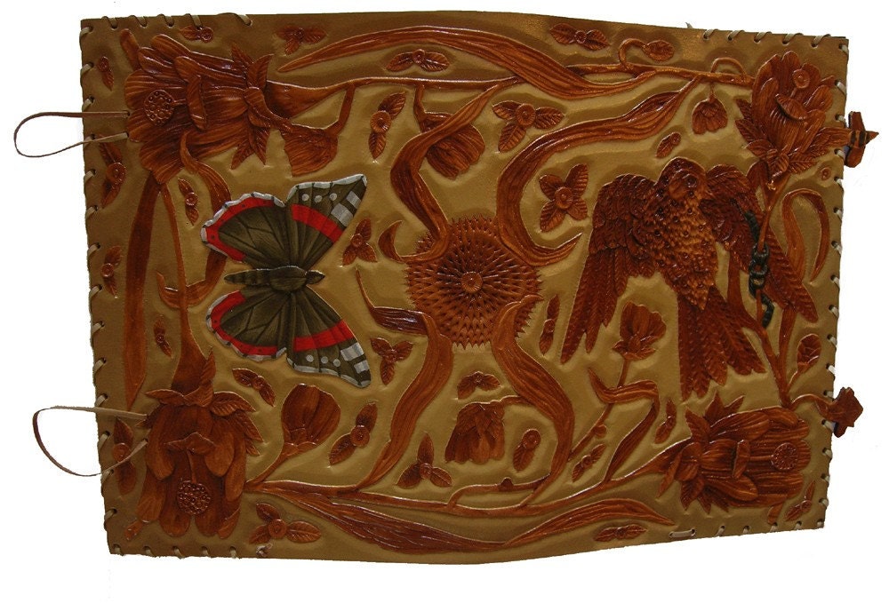 Hand carved leather book cover with bird, butterfly and flowers