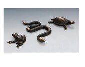 Solid Bronze Snake crawling across your tabletop rattlesnake
