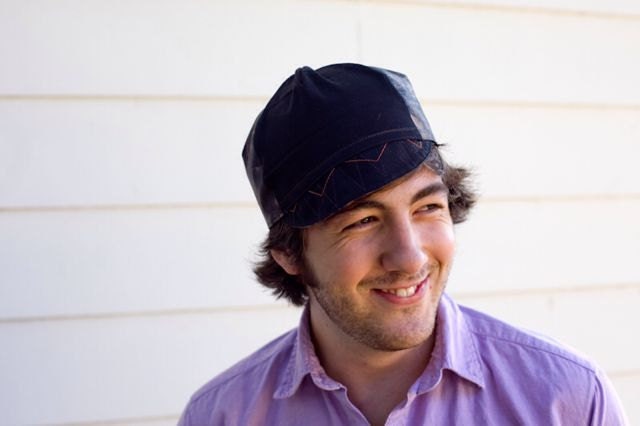 Cycling cap in real tree camo with flame orange thread accents