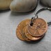 Lucky Us Copper Keychain with four lucky pennies