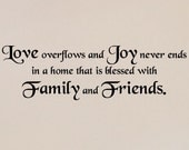 Love overflows and joy never ends in a home that is blessed with family and friends vinyl lettering wall saying 10x34