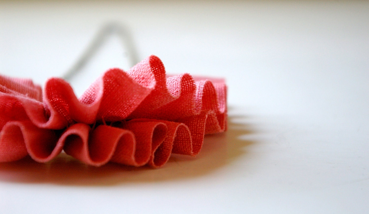 linen ruffle necklace in coral. antiqued bronze chain.