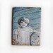 little girl and chair on cardboard