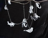 Transparent and white DOILY and TEXT animals plexi necklace