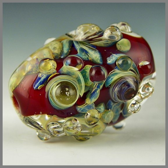 a beautiful red handmade lampwork focal with opulent opalescent frit - Red Dragon Egg