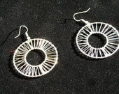 Silver hoop earrings.
