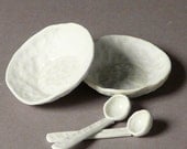 Pair of little salt cellar or teabag holders with matching miniature porcelain spoons