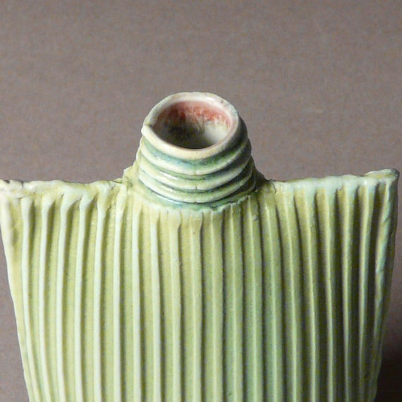Porcelain ribbed oval flask bottle vase in blue-green
