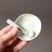 Pair of little salt cellar or teabag holders with matching miniature porcelain spoons