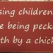 Raising children... pecked to death by a chicken sign