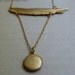 Feather locket necklace