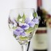 Hand painted wine glass in a perfect purple wrap around floral design. FREE personalization and dishwasher safe