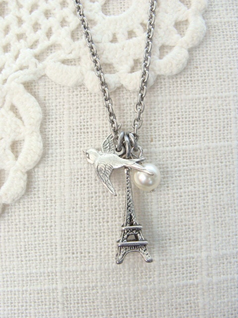 Fly to Paris.  Antique silver charm necklace.