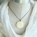 Creamy mum necklace. Antique brass.