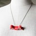 Coral patent leather - bow bracelet.