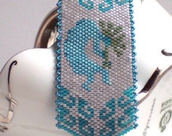 Kokopelli Peyote Handbeaded Bracelet in Silver and Turquoise Tones