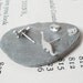 dinosaur earring studs in sterling silver, the brontosaurus version, handmade in the UK