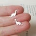 dinosaur earring studs in sterling silver, the brontosaurus version, handmade in the UK