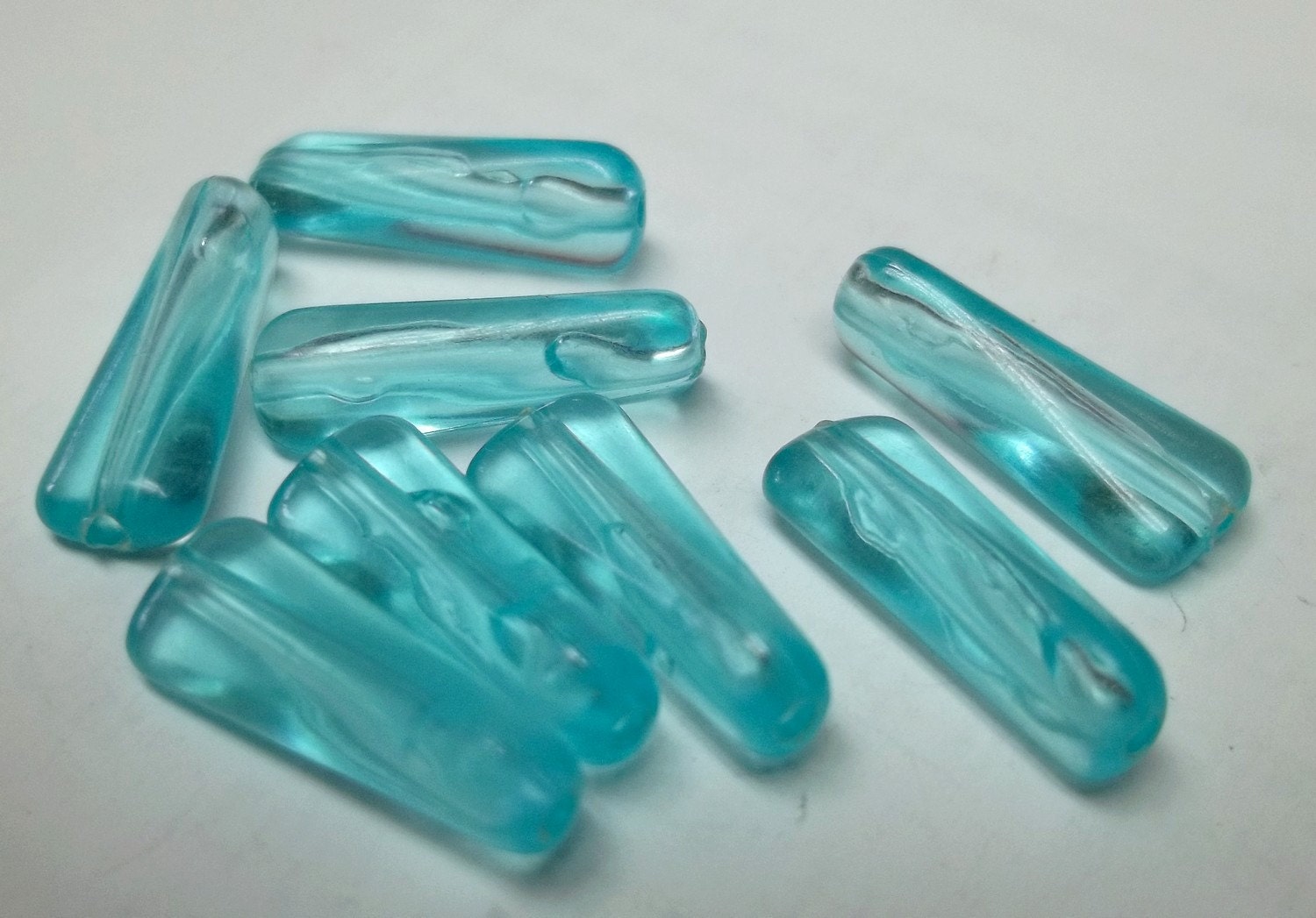 Ice blue 12x7 vintage oblong plastic bead