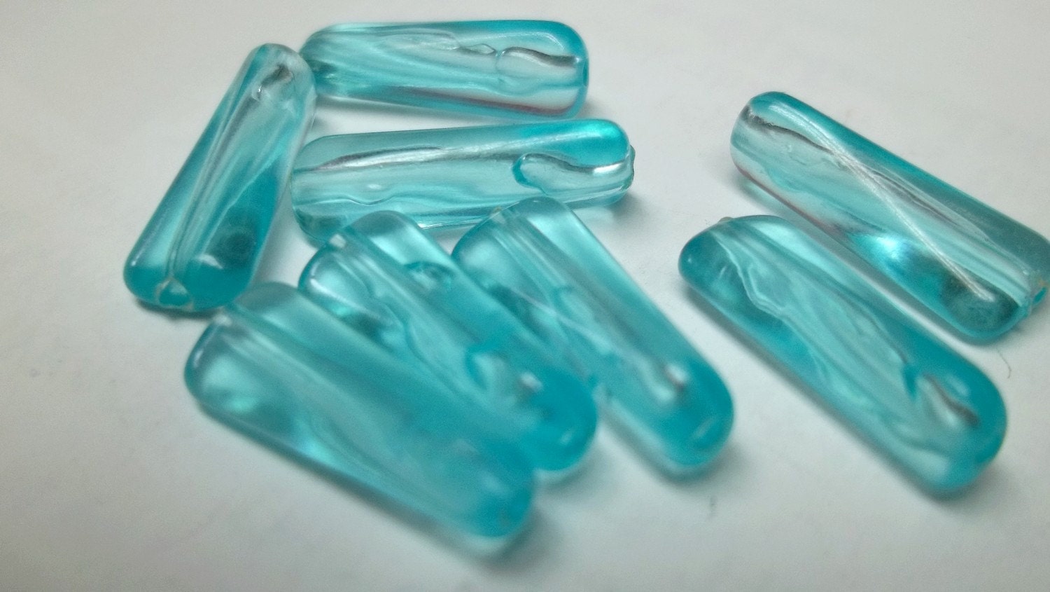 Ice blue 12x7 vintage oblong plastic bead