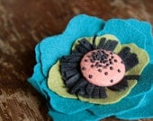 Anemone by Benzie, a felt flower brooch in teal peacock
