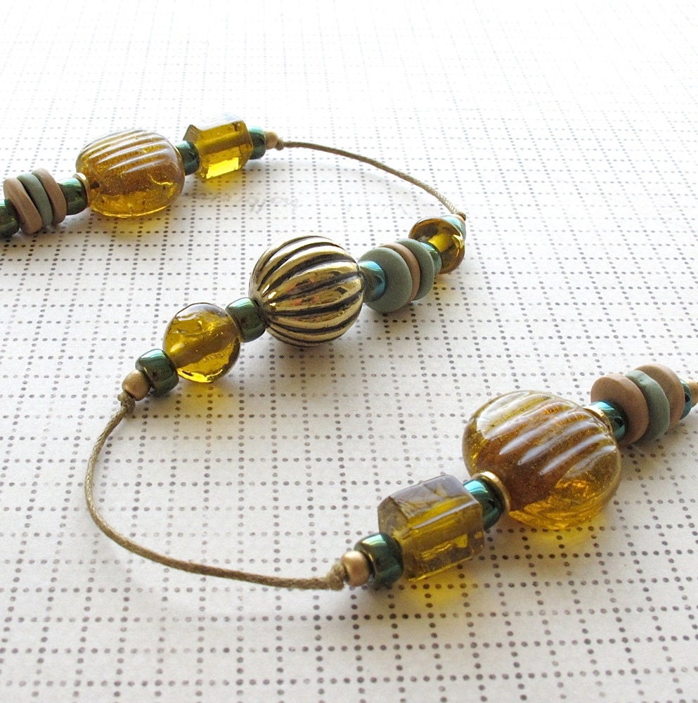Beaded Garden Chime: Windchime with Topaz Gold & Metallic Green Glass Beads. Brass Bell