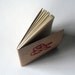 stitched moleskine notebook, red ampersand (lined pages)