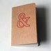 stitched moleskine notebook, red ampersand (lined pages)