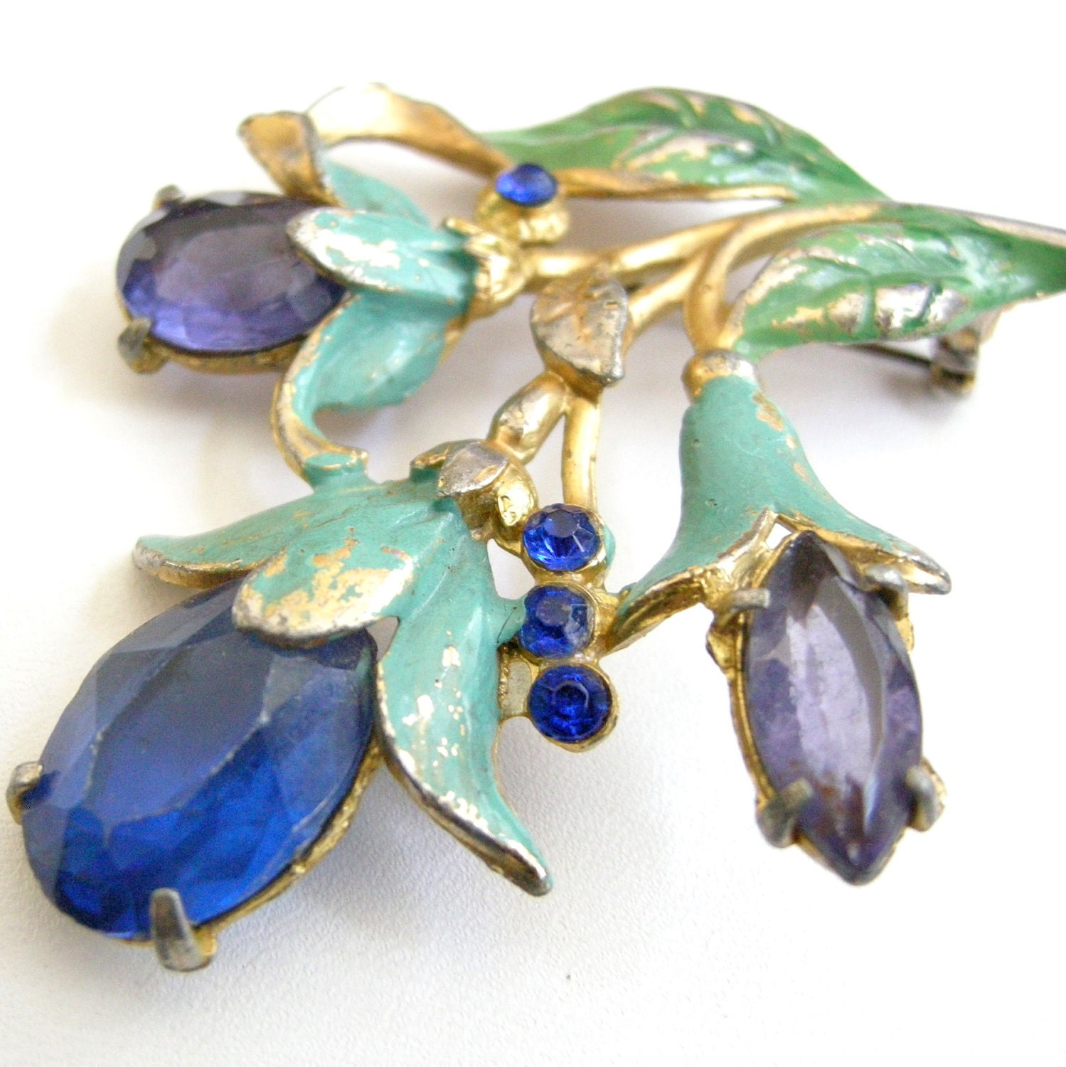 Vintage gold tone pot metal bouquet brooch with blue plastic cabs, enamel