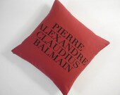 Iconic Haute Couture Designer Name silk screened cotton canvas throw pillow 18" red/black