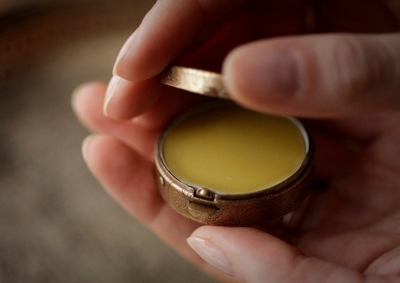 Antique Settee - natural solid perfume in brass compact
