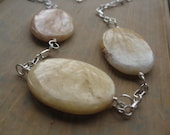silver necklace in peach cream and pink aventurine. wire wrapped necklace. pastel jewelry. splurge.