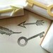treasure rubber stamps. hand carved rubber stamp. hand carved stamp. key/feather/arrow. set of 3. mounted.