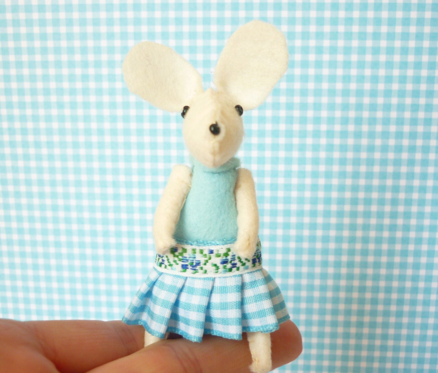 White mouse plush in matchbox bed
