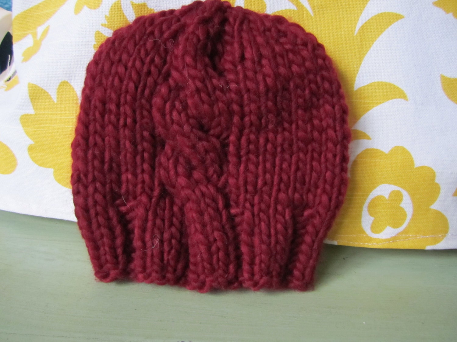 Singular sensation - Red hand knit baby had with single cable