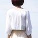 Off-white cropped bamboo jersey kimono top / jacket with popper closure
