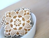 square doily coasters with natural woodgrain
