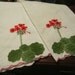 Set of 2 hand embroidered and appliqued tea towels with geranium flowers