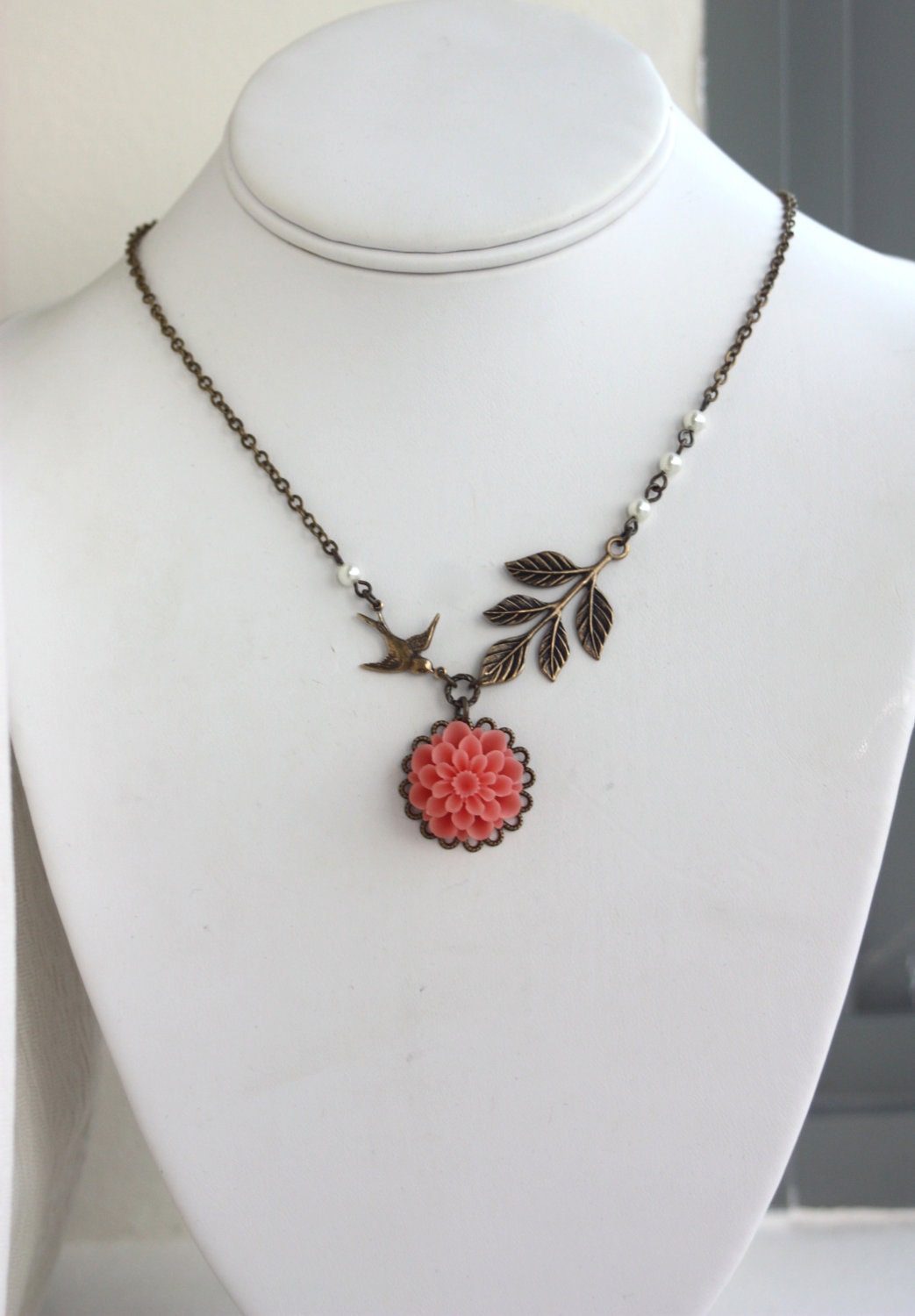 A Soft Coral Chrysanthemum, Dahlia Flower, Flying Bird, and Leaf Branch with Ivory Pearls Necklace. Gift Ideas for Bridesmaids.