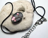 Cherry Blossoms. A sculpted handmade ' Pebble ' pendant on a satin cord necklace. Original artwork.