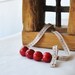 Necklace Red resin beads and bow