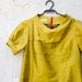 Mustard Yellow Dress in Silk with raised neckline and puffy sleeves