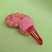 Brain Hair Clip Side View on Red Clip