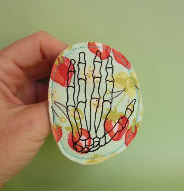 Skeleton Hand Badge Screen Printed on Strawberry Fabric