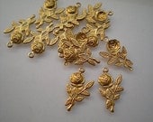 12 small brass rose charms
