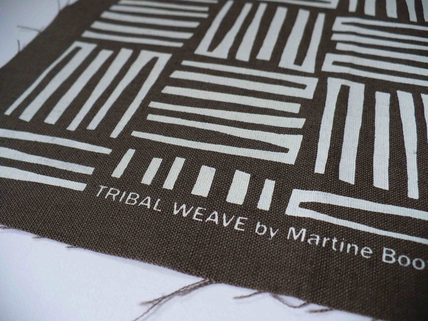 screenprinted fabric printed white on mud brown cotton linen TRIBAL WEAVE design