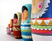 handmade wood folk art nesting dolls... wool sweater Eskimos