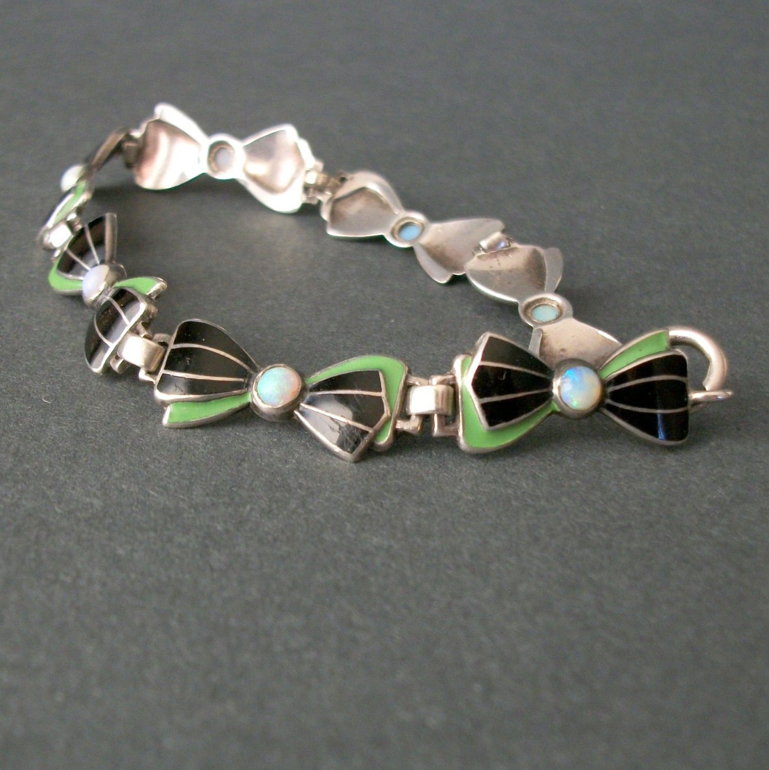 Art Deco Bracelet . Enameled Sterling Bows with Opals . Green and Black .