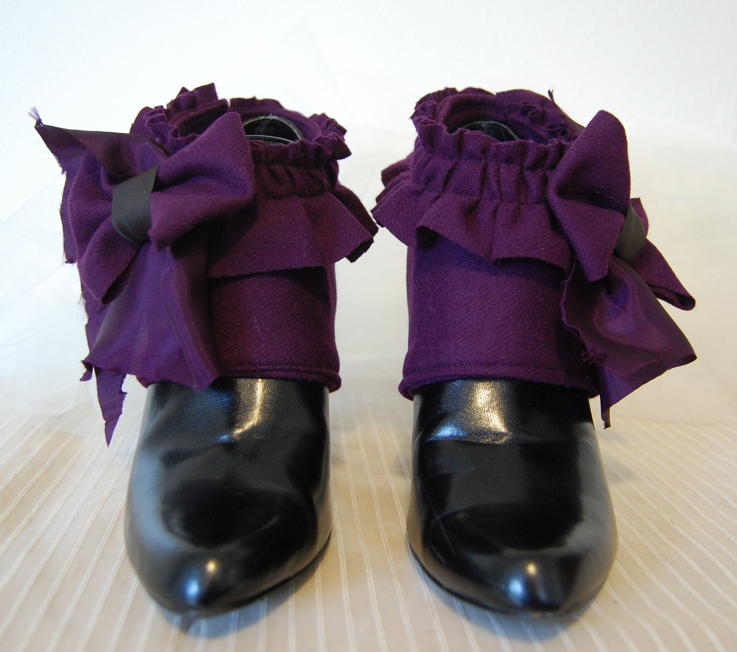 Purple Victorian steampunk fashion spats made from repurposed fabrics.